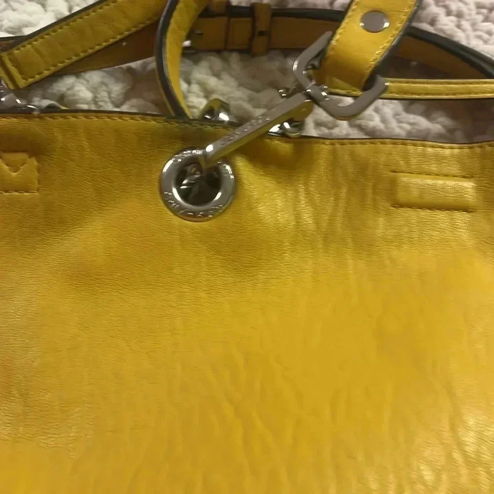 Calvin Klein few spots well loved pvc material.